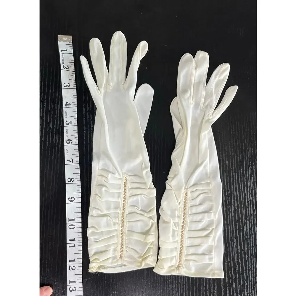 Vintage 60's era elegant long dress gloves tagged with faux pearl accents